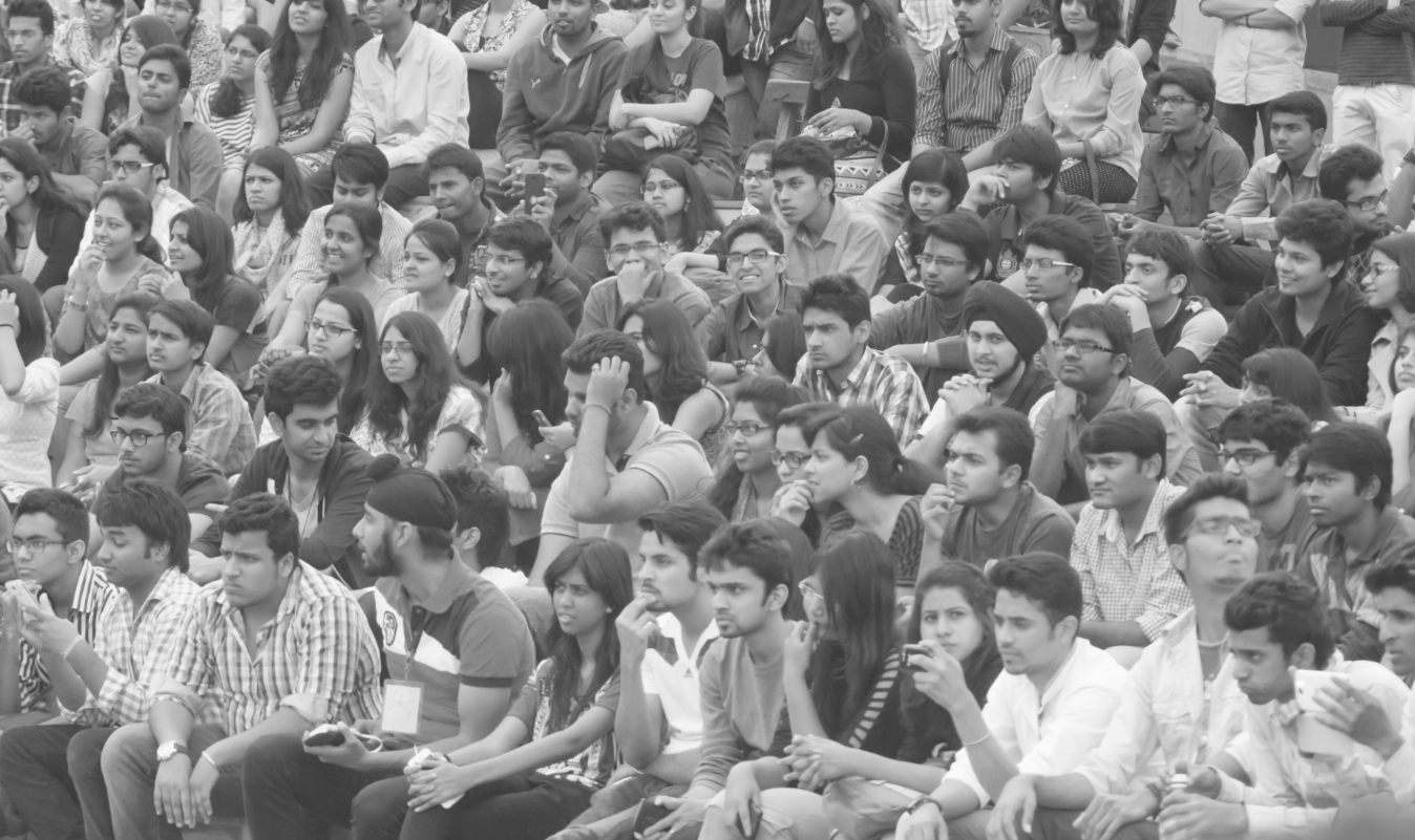 a black and white picture of students sitting